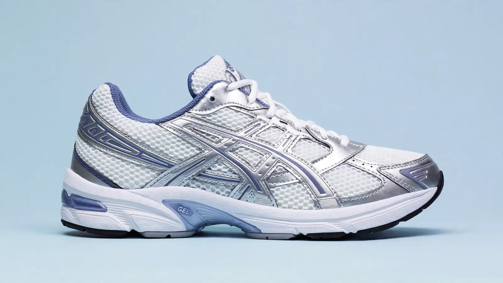 ASICS Gel-1130 white and silver sneaker showing technical Y2K runner aesthetic