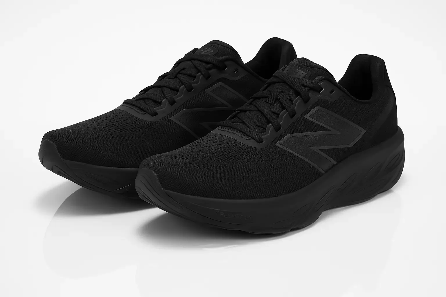 New Balance Fresh Foam X 1080 V14 in all-black with mesh upper, tonal 'N' logo, and cushioned running sole.