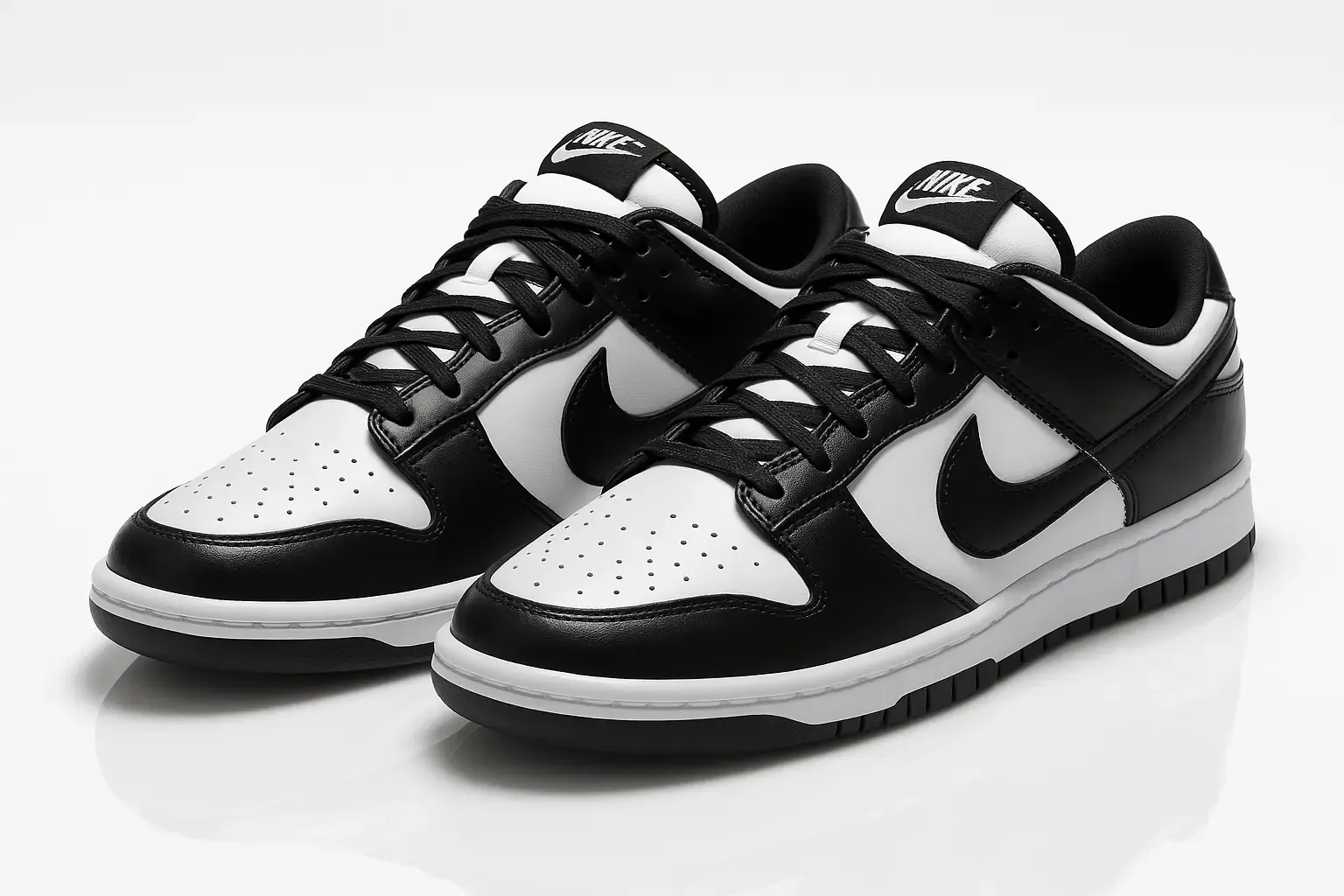 Nike Dunk Low in the black and white 'Panda' colorway with perforated toe box and classic basketball-inspired silhouette.