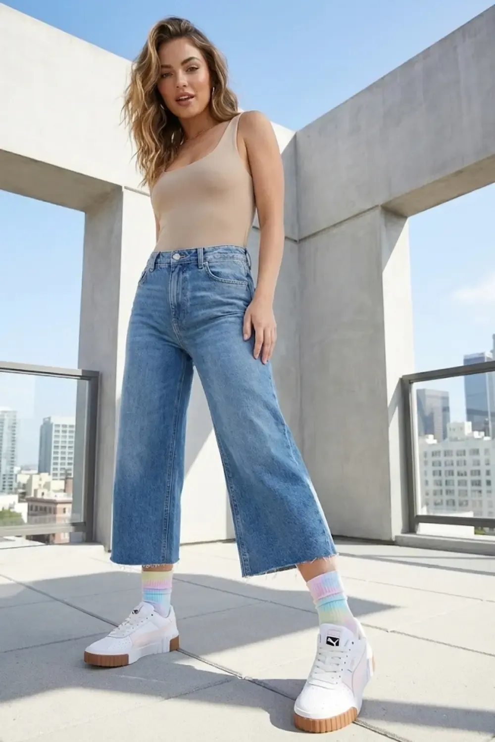 Trend-forward woman with playful street styling and Puma Cali sneakers