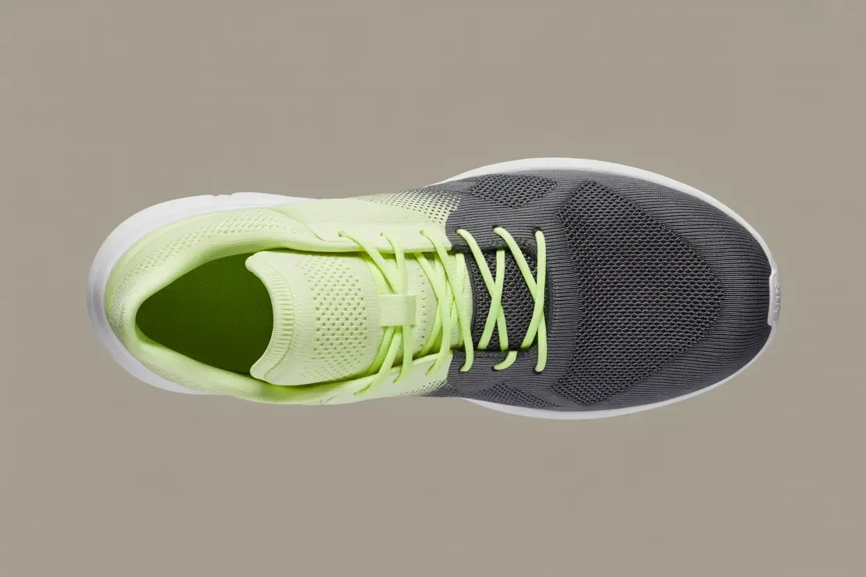 Close-up view of a sneaker upper showing a contrast between breathable engineered mesh and a denser knit material.